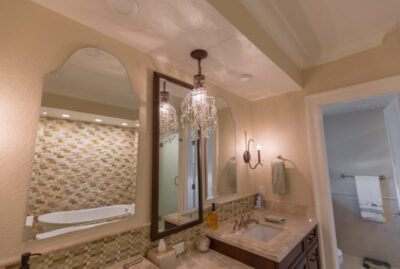 Double Sinks, Custom Cabinetry, A Make-up table & Custom Lighting!