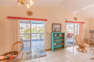 Double Sliding Glass Doors Leading to Screened In Patio