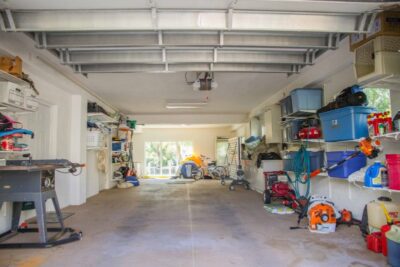 Large Garage with plenty of storage and shelf space.