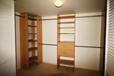 Large walk-in closet with built-ins