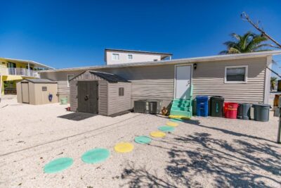 2 storage sheds and side entrance to house