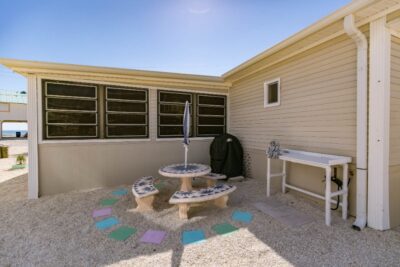 Outdoor sitting area with grill & fish cleaning station