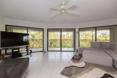 3 Sliding Glass Doors lead to large screened in patio