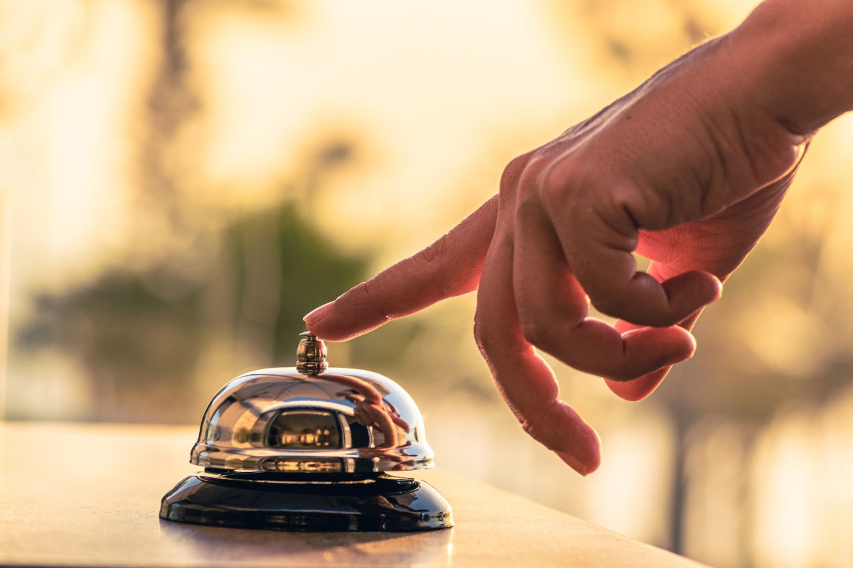 hand ringing the bell